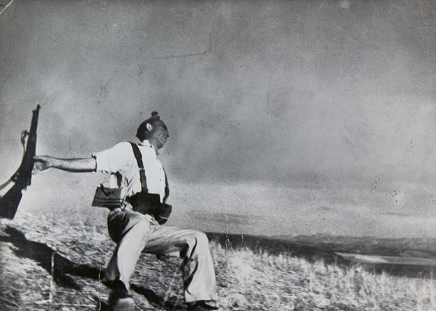 ROBERT CAPA (1913–1954) ‘The Falling soldier’ (Loyalist Militiaman at the Moment of Death), Córdoba front, September 5th, 1936 Gelatin silver print, printed in the 1950s, early exhibition print 24,4 × 34,1 cm (9.6 × 13.4 in) Photographer’s agency stamp on the reverse, label with typographic annotations reading “This is Capa’s most famous single picture, which came out of his reportage on the Spanish Civil War in 1936. Capa’s camera caught the soldier at the very moment of death, as he was killed by a machine-gun bullet through his head” on the reverse